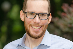 sydney-corporate-outdoor-portrait-glasses-light-shirt-matthew-with-a-camera