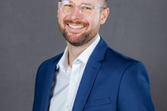 sydney-corporate-portrait-blue-suit-glasses-matthew-with-a-camera