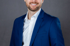 sydney-corporate-portrait-blue-suit-hands-together-matthew-with-a-camera