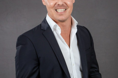 sydney-corporate-portrait-dark-suit-open-collar-matthew-with-a-camera