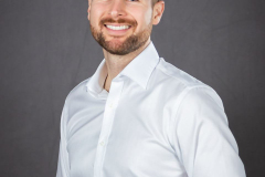 sydney-corporate-portrait-white-shirt-grey-background-matthew-with-a-camera