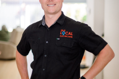 sydney-corporate-workplace-portrait-black-polo-hands-on-hips-matthew-with-a-camera