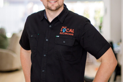 sydney-corporate-workplace-portrait-black-uniform-shirt-matthew-with-a-camera